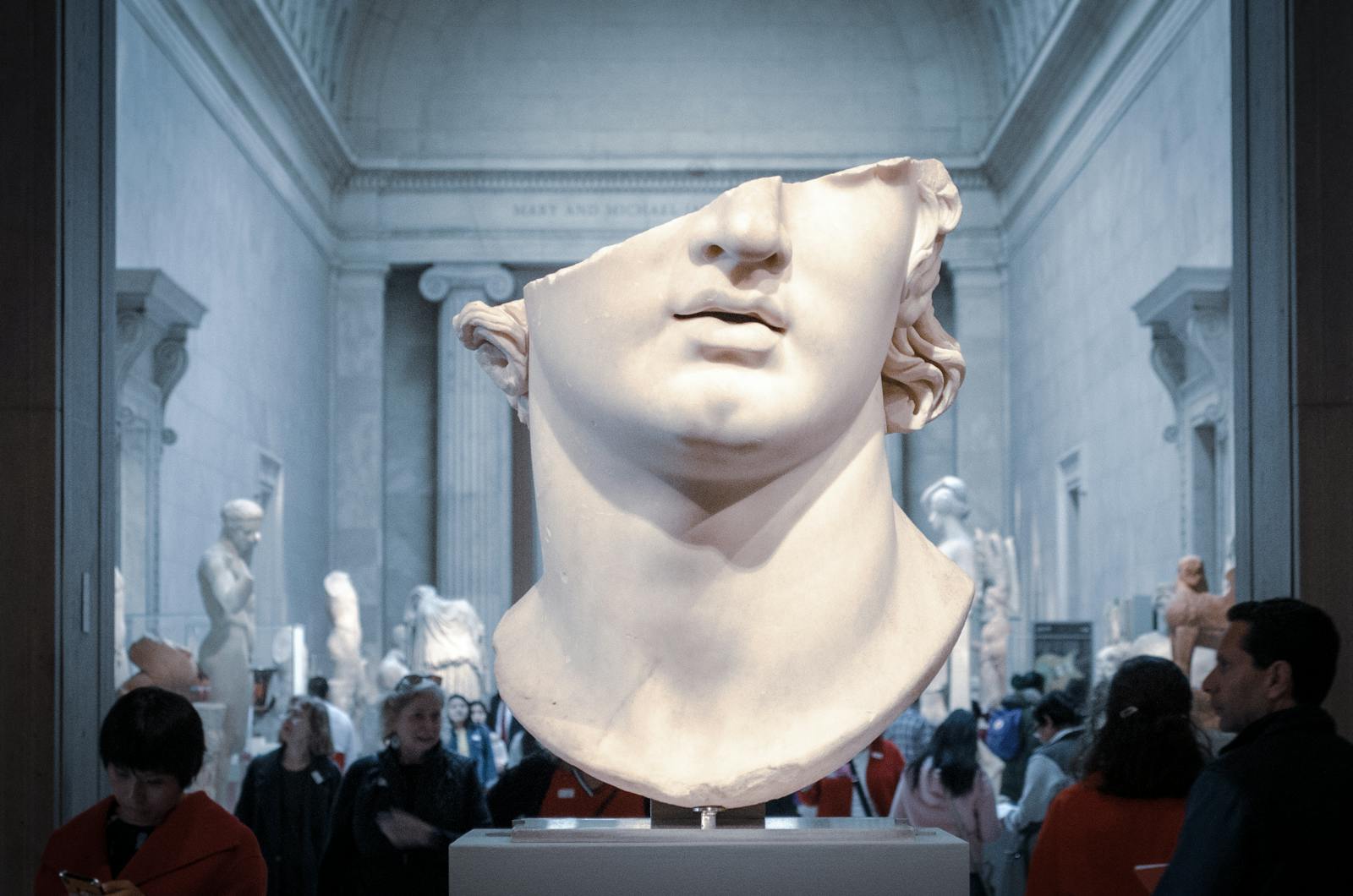 Photo by Jose Antonio Gallego Vázquez Greek marble head bust on display in a New York City museum exhibit.